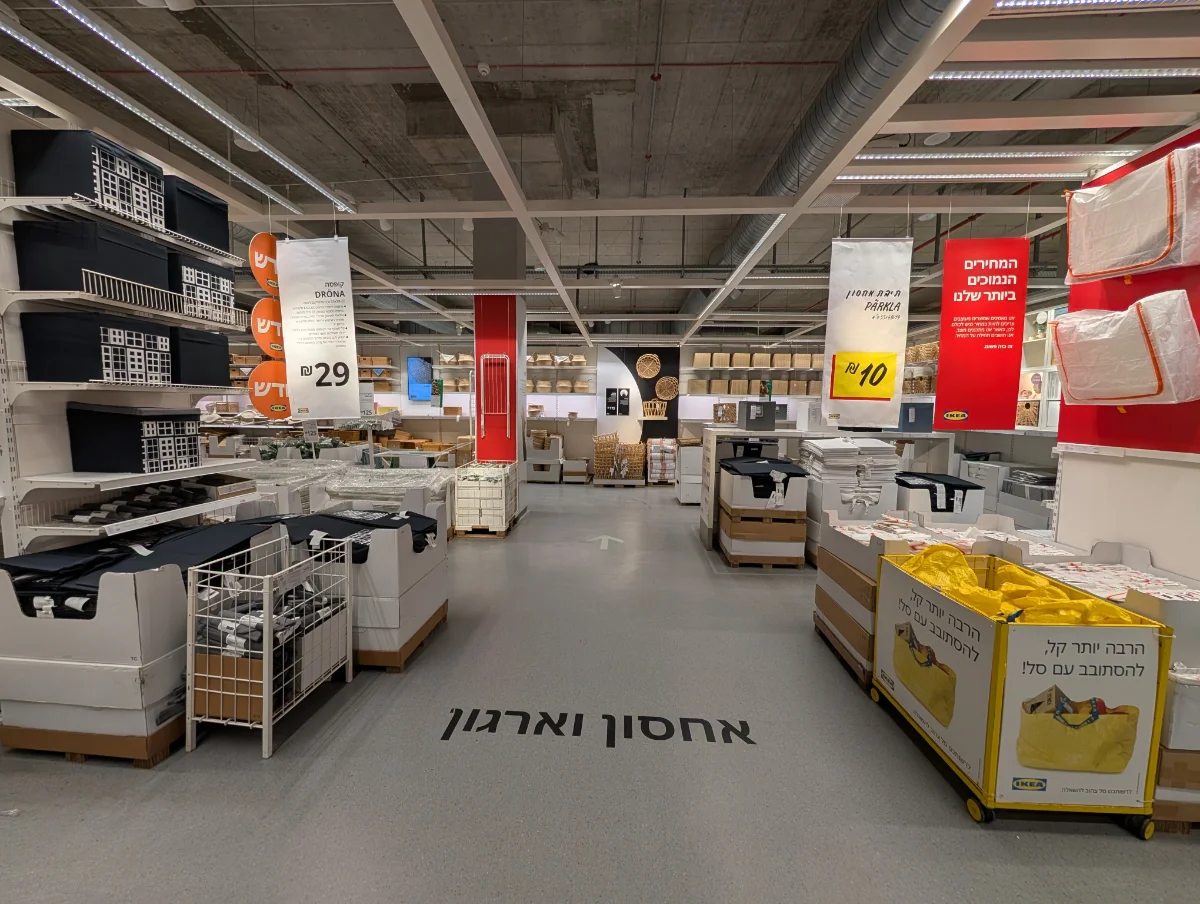 Lead 'after' photo — the most polished, well-lit shot of the redesigned department (trail + product grouping clearly visible)